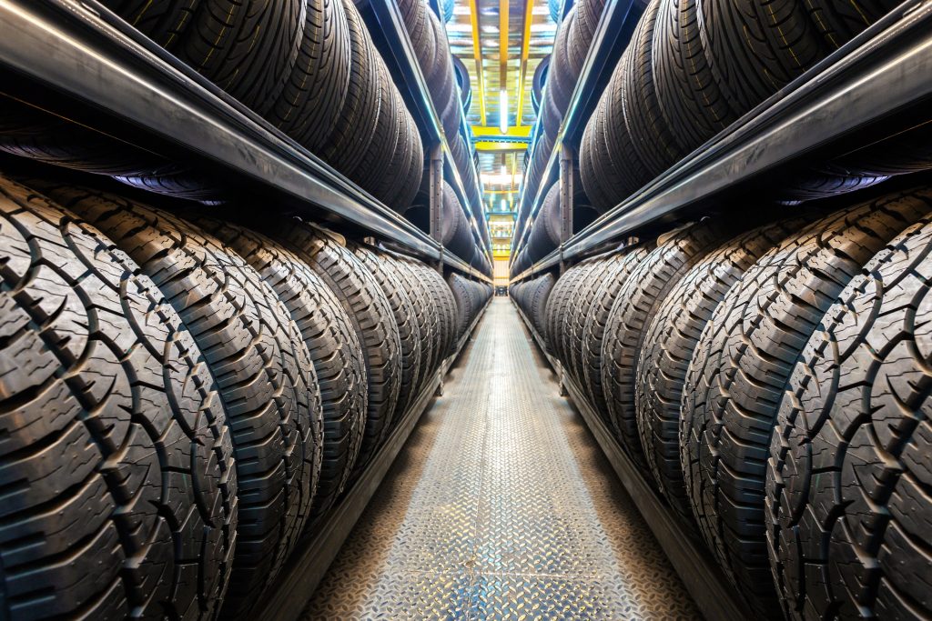 A surplus of tires being stored in a large tire store. - Boyd Honda Oxford, NC