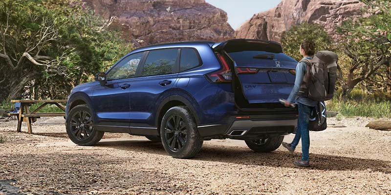 A women is opening the trunk of 2026 Honda CR-V